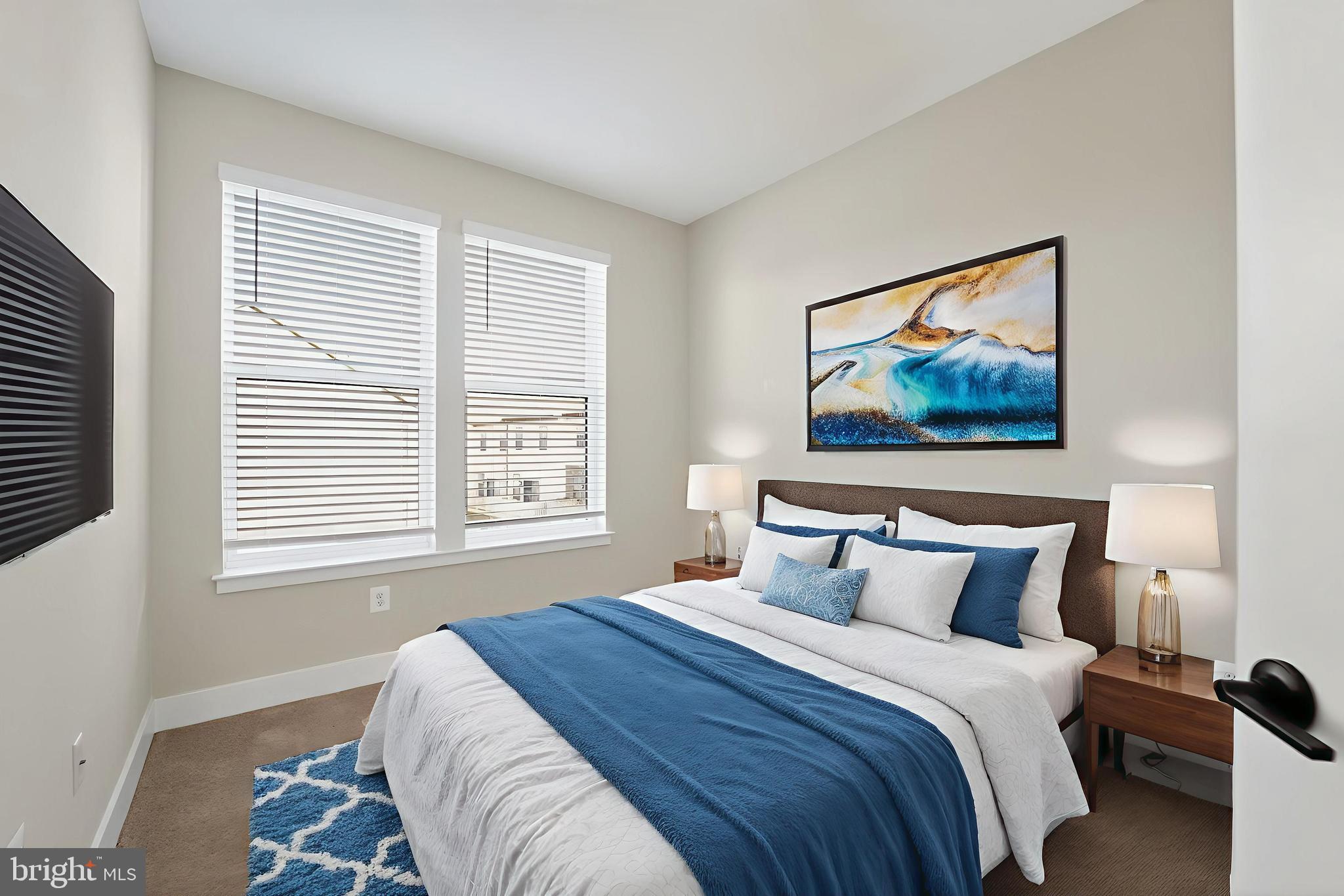 1511 Roland Heights Avenue Baltimore, MD 21211 - Photo 34 of 42 a bedroom with a bed and a painting on the wall