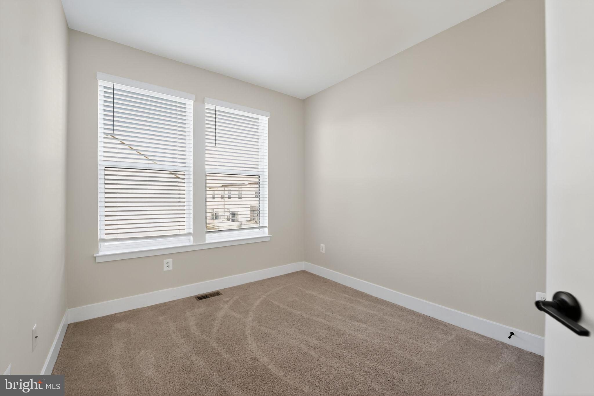 1511 Roland Heights Avenue Baltimore, MD 21211 - Photo 35 of 42 an empty room with a window