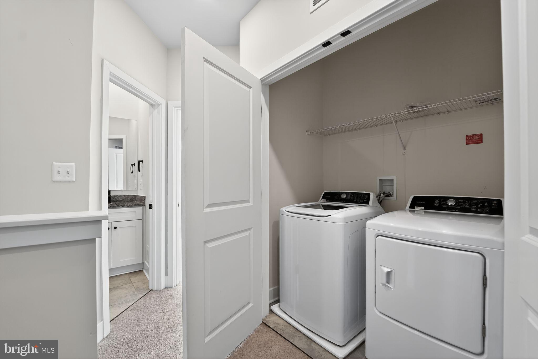 1511 Roland Heights Avenue Baltimore, MD 21211 - Photo 37 of 42 a utility room with dryer and washer