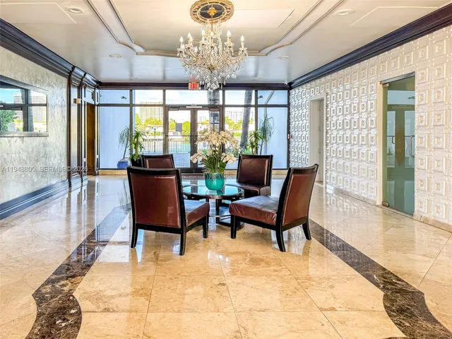 a view of a livingroom with wooden floor and furniture