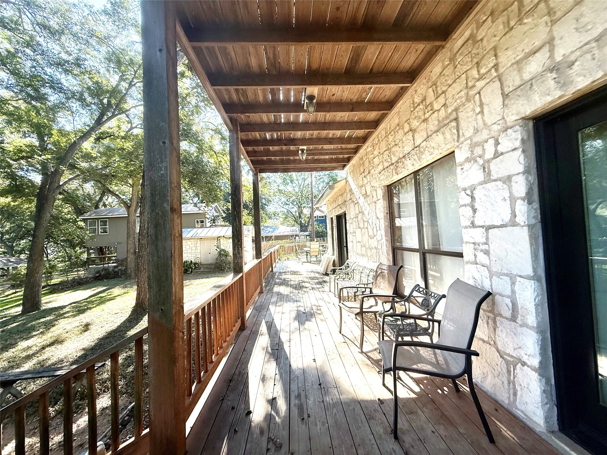 9030 River Road New Braunfels, TX 78132 - Photo 12 of 25 a view of a patio with table and chairs and wooden floor