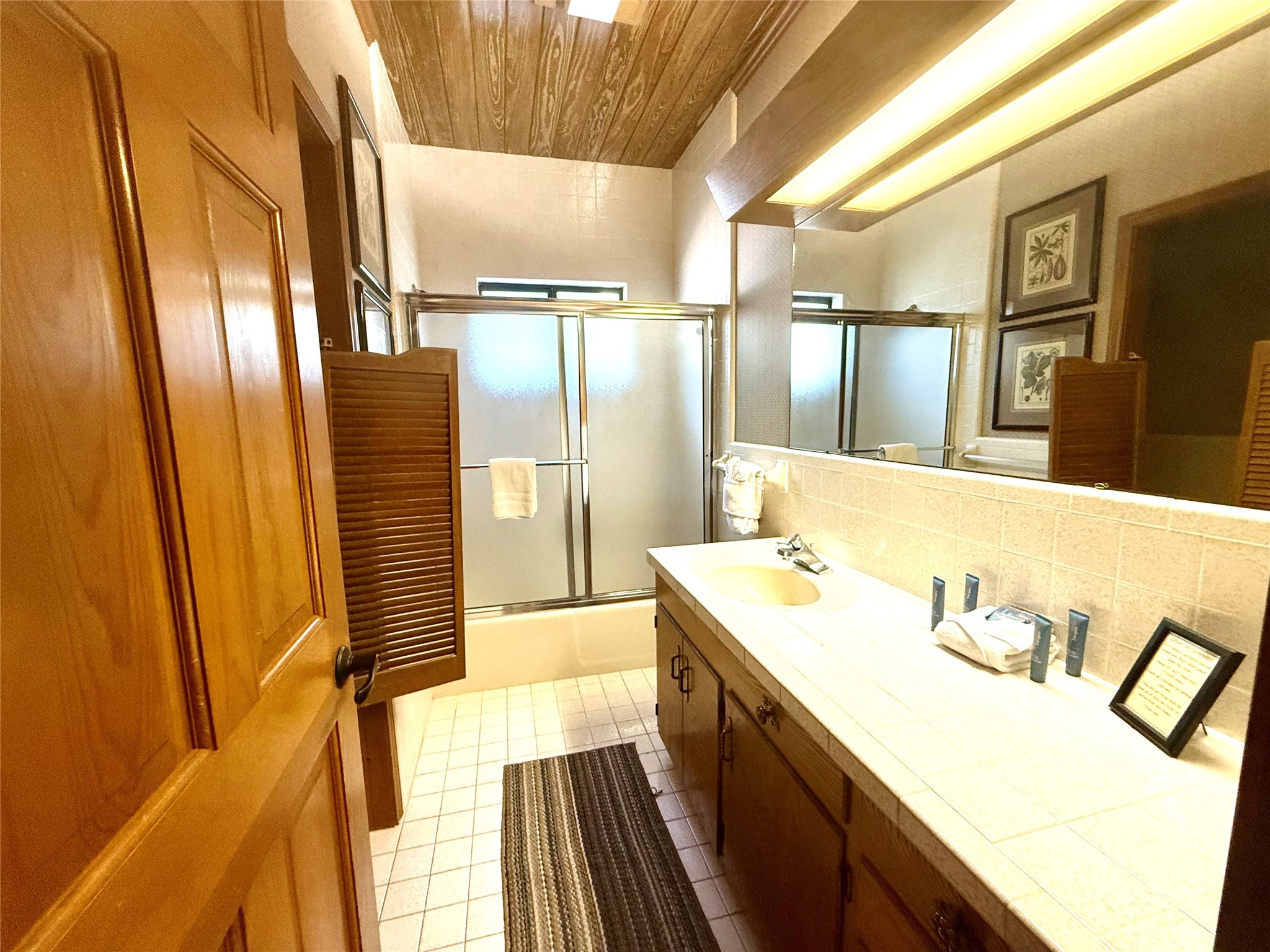 9030 River Road New Braunfels, TX 78132 - Photo 21 of 25 a bathroom with a sink and a mirror