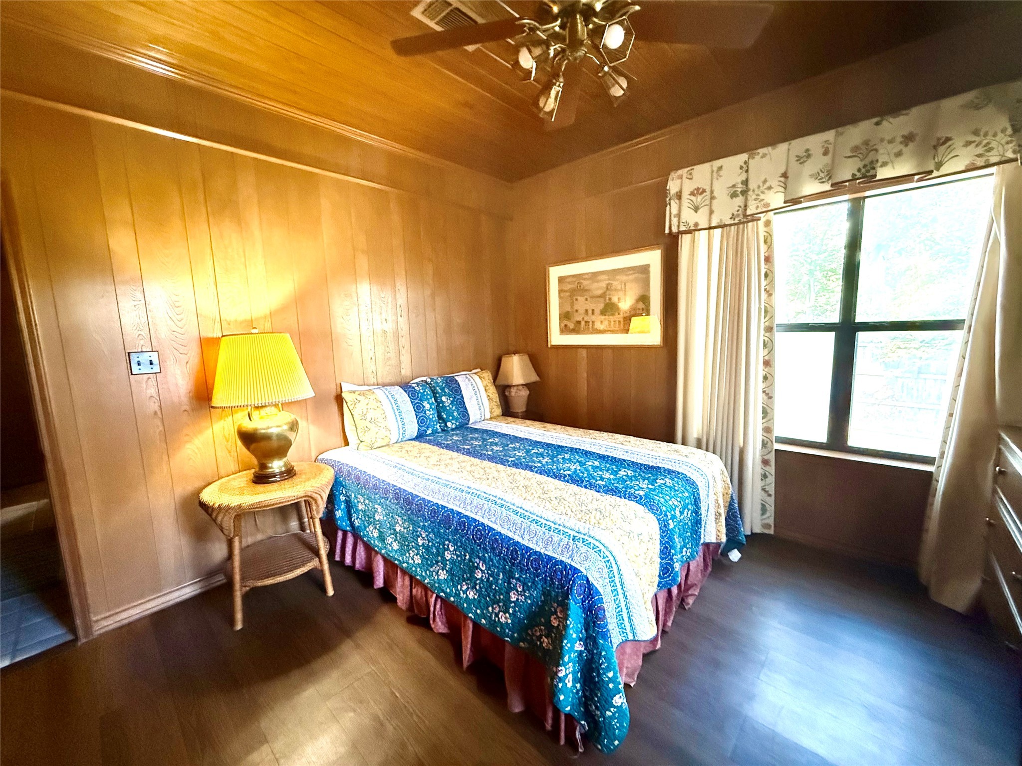 9030 River Road New Braunfels, TX 78132 - Photo 22 of 25 a bedroom with a bed and wooden floor