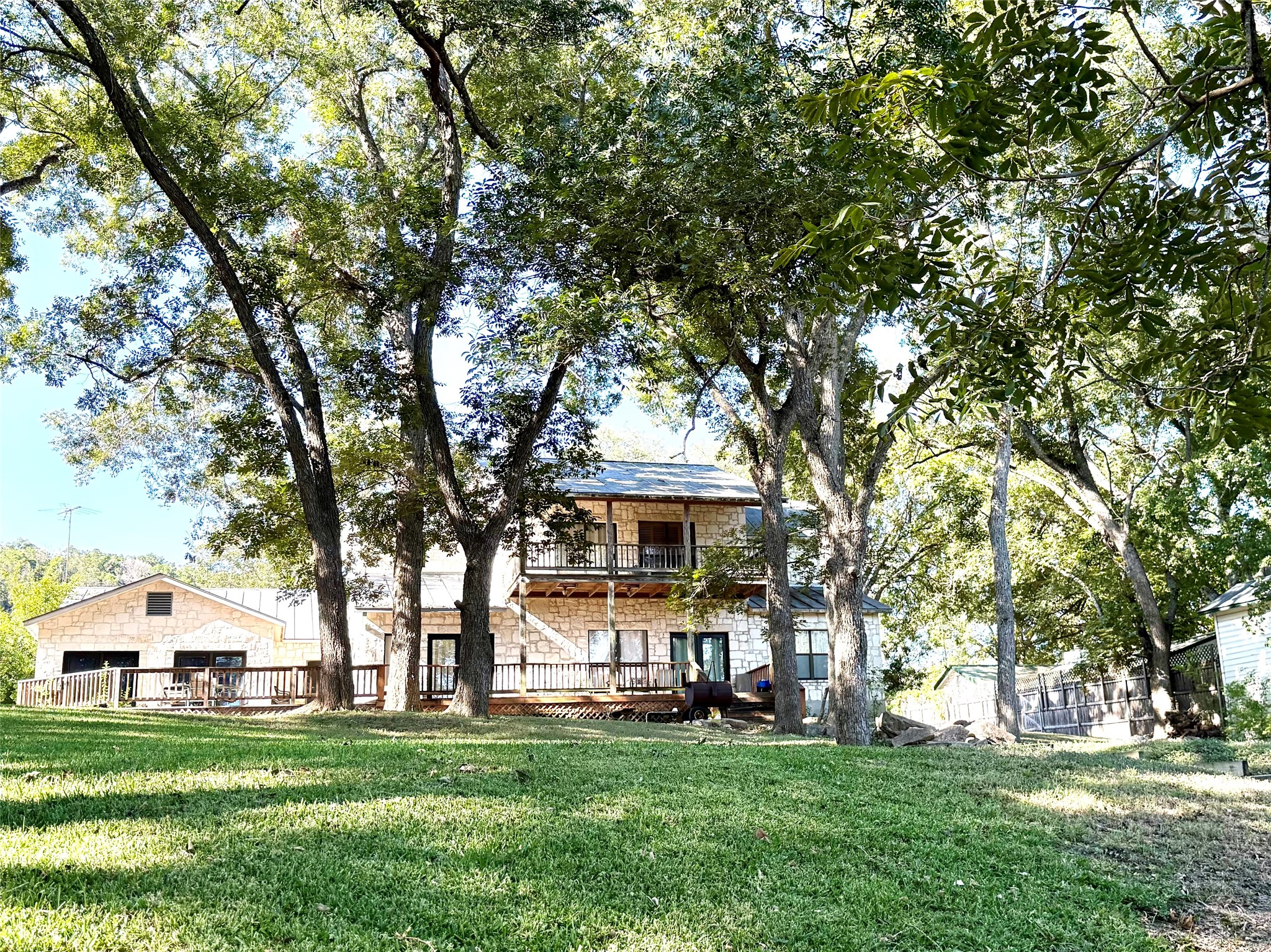 9030 River Road New Braunfels, TX 78132 - Photo 7 of 25 a front view of a house with a garden