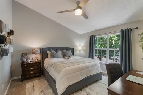 a bedroom with a bed and a couch