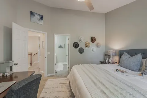 a bedroom with a large bed and a couch