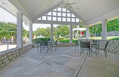 a view of a swimming pool with a patio
