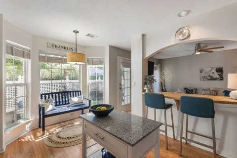 a view of a dining room with furniture window and outside view