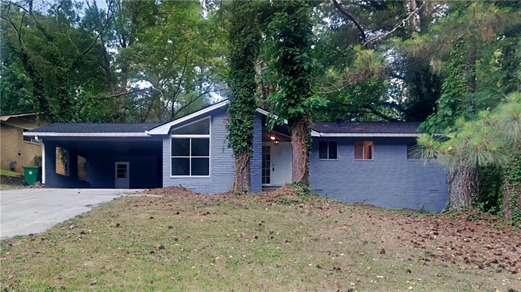 3302 Tulip Drive Decatur, GA 30032 - Photo 1 of 1 a front view of a house with a yard and garage
