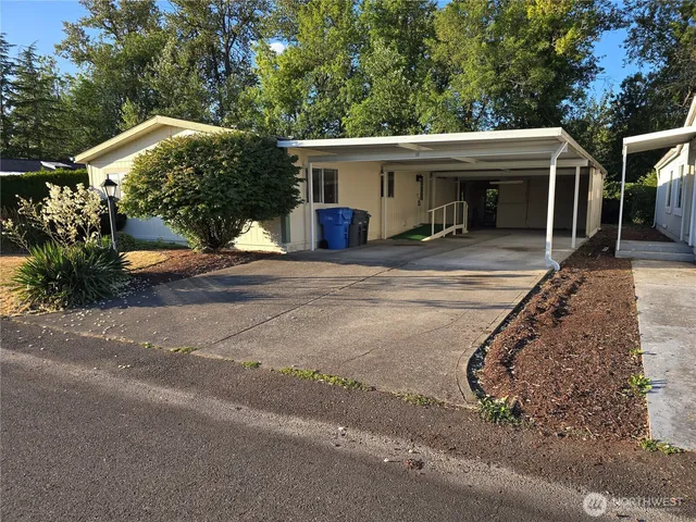 a view of a house with a street