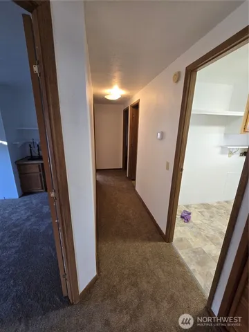 a view of a hallway to other door