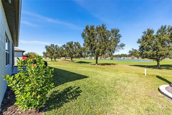 a view of a lake with a yard