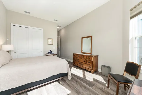 a house view with swimming pool in front of it