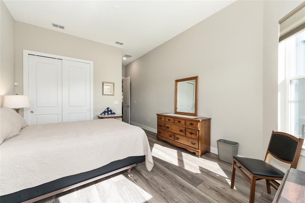 8843 Southwest 57th Pl Road Ocala, FL 34481 - Photo 34 of 64 a bedroom with a bed and chair