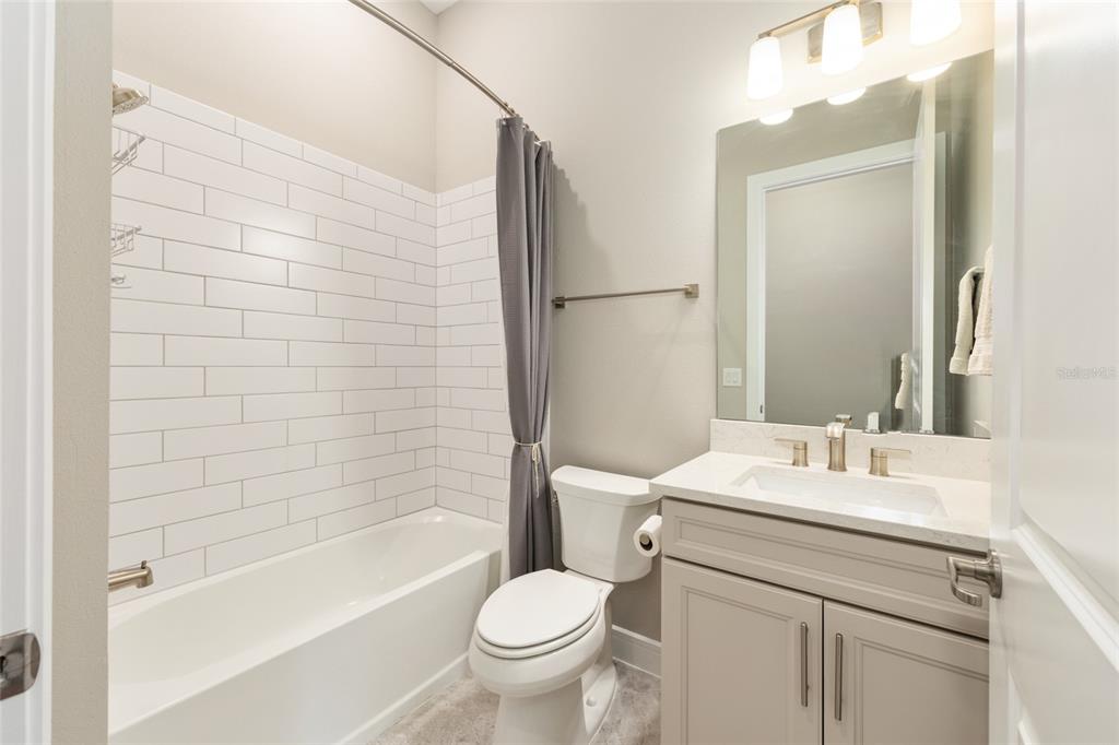 8843 Southwest 57th Pl Road Ocala, FL 34481 - Photo 38 of 64 a bathroom with a sink toilet and shower