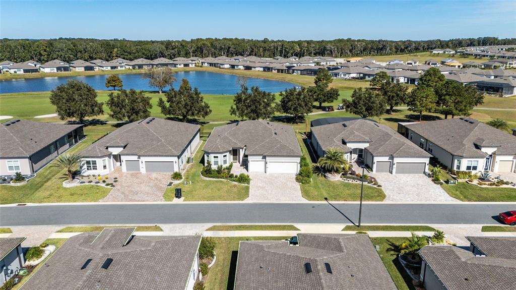 8843 Southwest 57th Pl Road Ocala, FL 34481 - Photo 43 of 64 an aerial view of residential houses with outdoor space and swimming pool