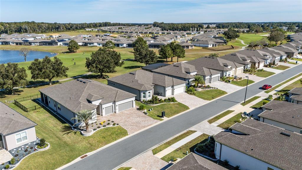 8843 Southwest 57th Pl Road Ocala, FL 34481 - Photo 44 of 64 an aerial view of residential houses with outdoor space