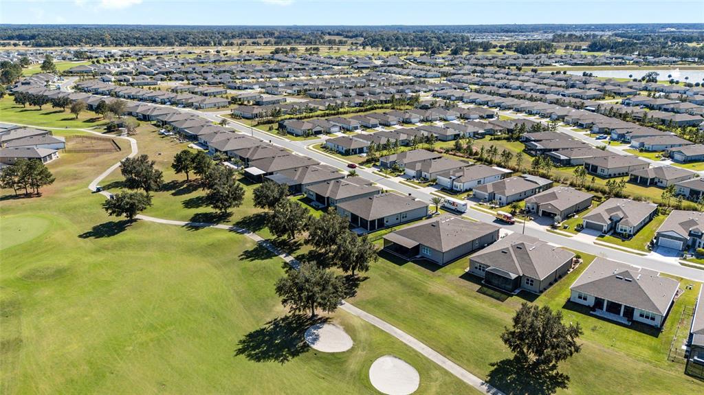 8843 Southwest 57th Pl Road Ocala, FL 34481 - Photo 47 of 64 an aerial view of a house with a swimming pool