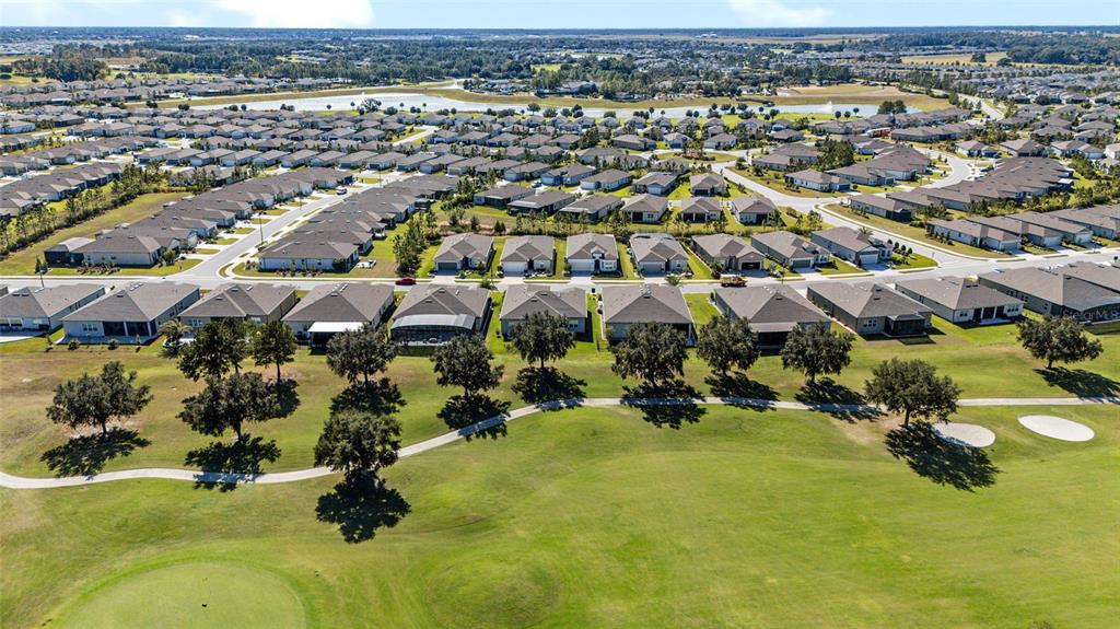 8843 Southwest 57th Pl Road Ocala, FL 34481 - Photo 48 of 64 an aerial view of residential houses with outdoor space