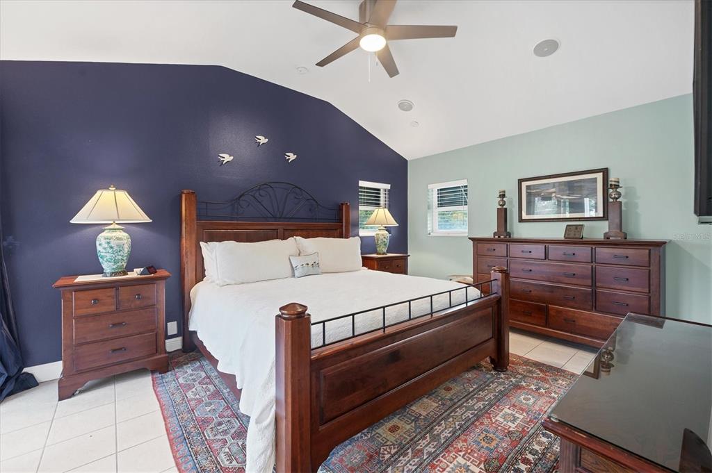 200 Cocoanut Avenue, Unit 7 Sarasota, FL 34236 - Photo 11 of 32 a bed room with a bed and a dresser