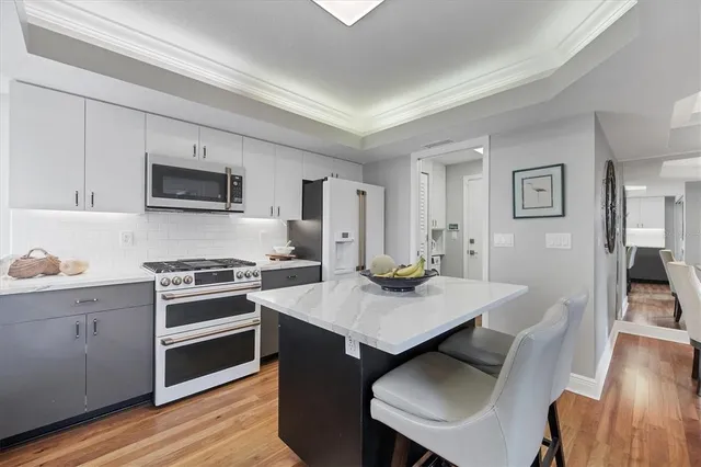 a view of kitchen with sink dining table and chairs