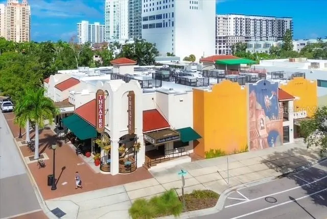a view of a swimming pool with outdoor seating space