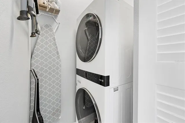 a close view of a utility room with dryer and washer
