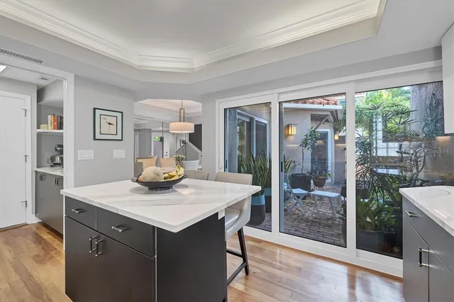 a view of kitchen island with furniture and wooden floor