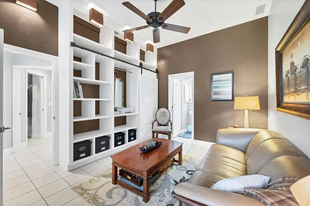 a living room with furniture a rug and a chandelier