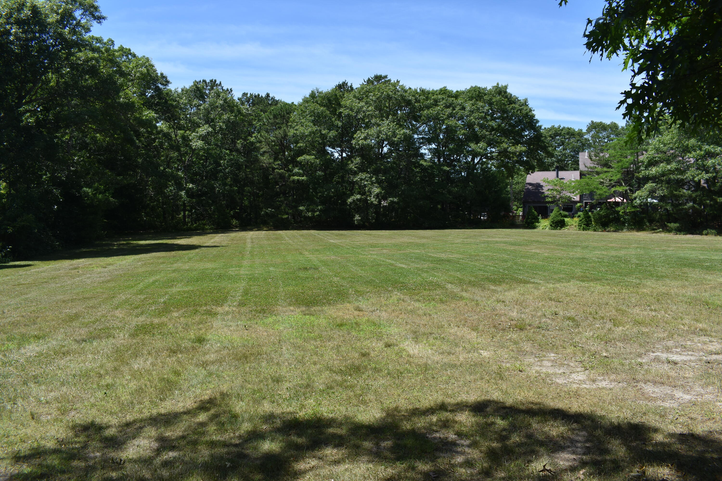 6 Round House Road Bourne, MA 02532 - Photo 22 of 25 a view of a field with trees in the background