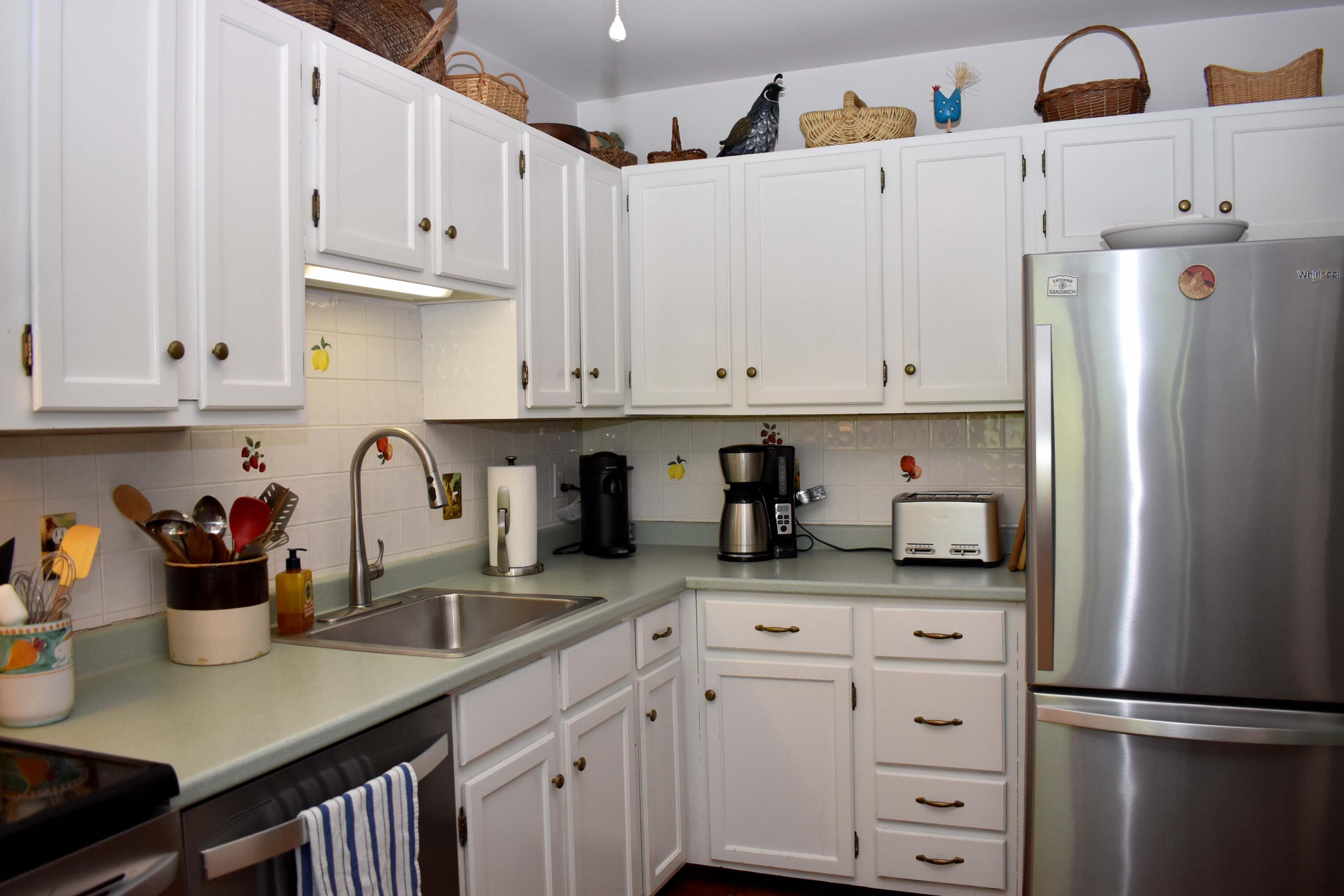 6 Round House Road Bourne, MA 02532 - Photo 8 of 25 a kitchen with refrigerator and cabinets