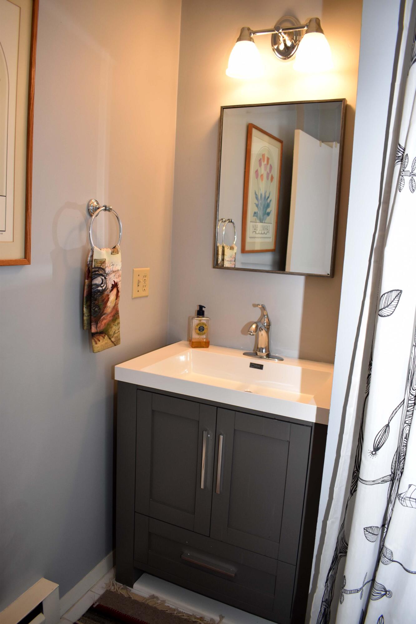6 Round House Road Bourne, MA 02532 - Photo 9 of 25 a bathroom with a sink vanity and mirror