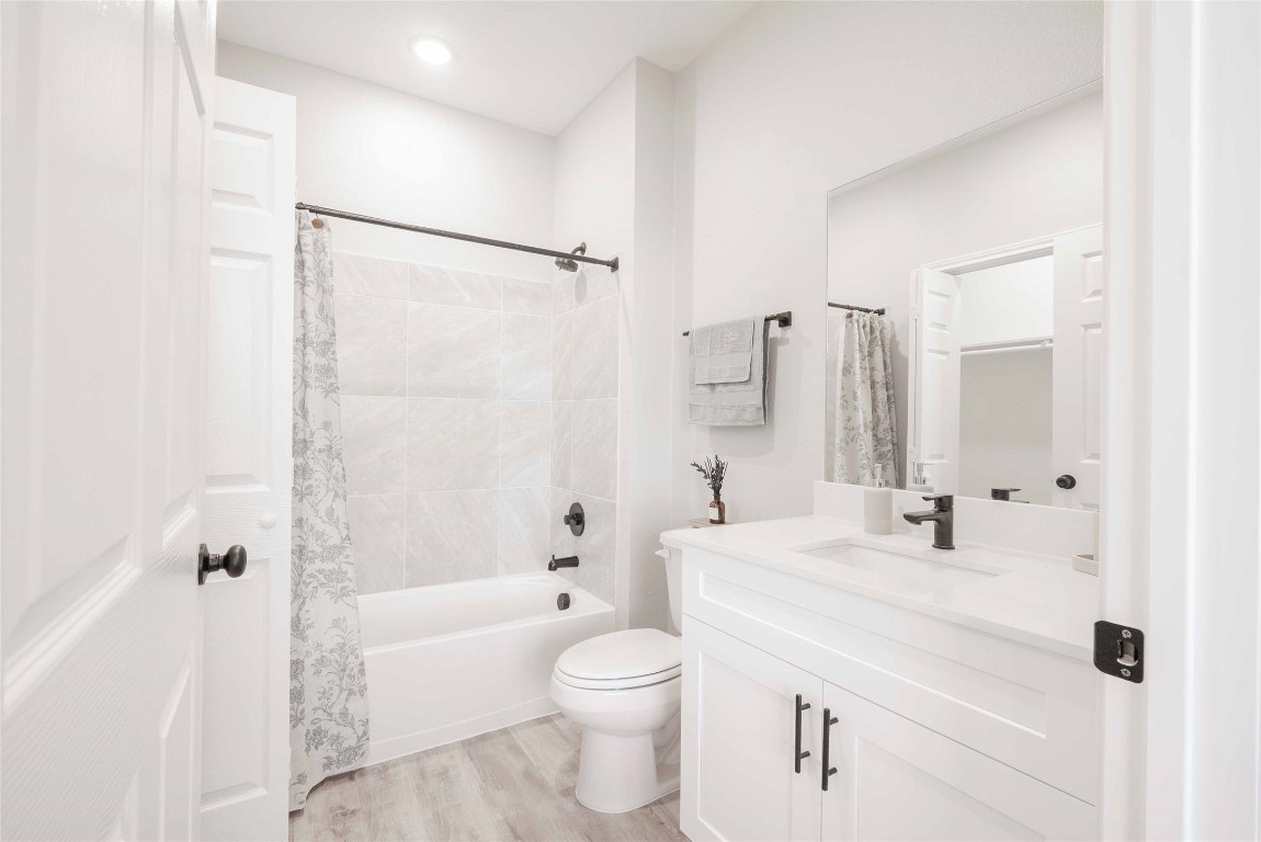 2101 Reinke Road, Unit 2106 Waller, TX 77484 - Photo 15 of 20 a bathroom with a sink a toilet and shower