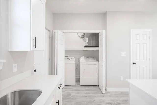 a view of a hallway with white walls
