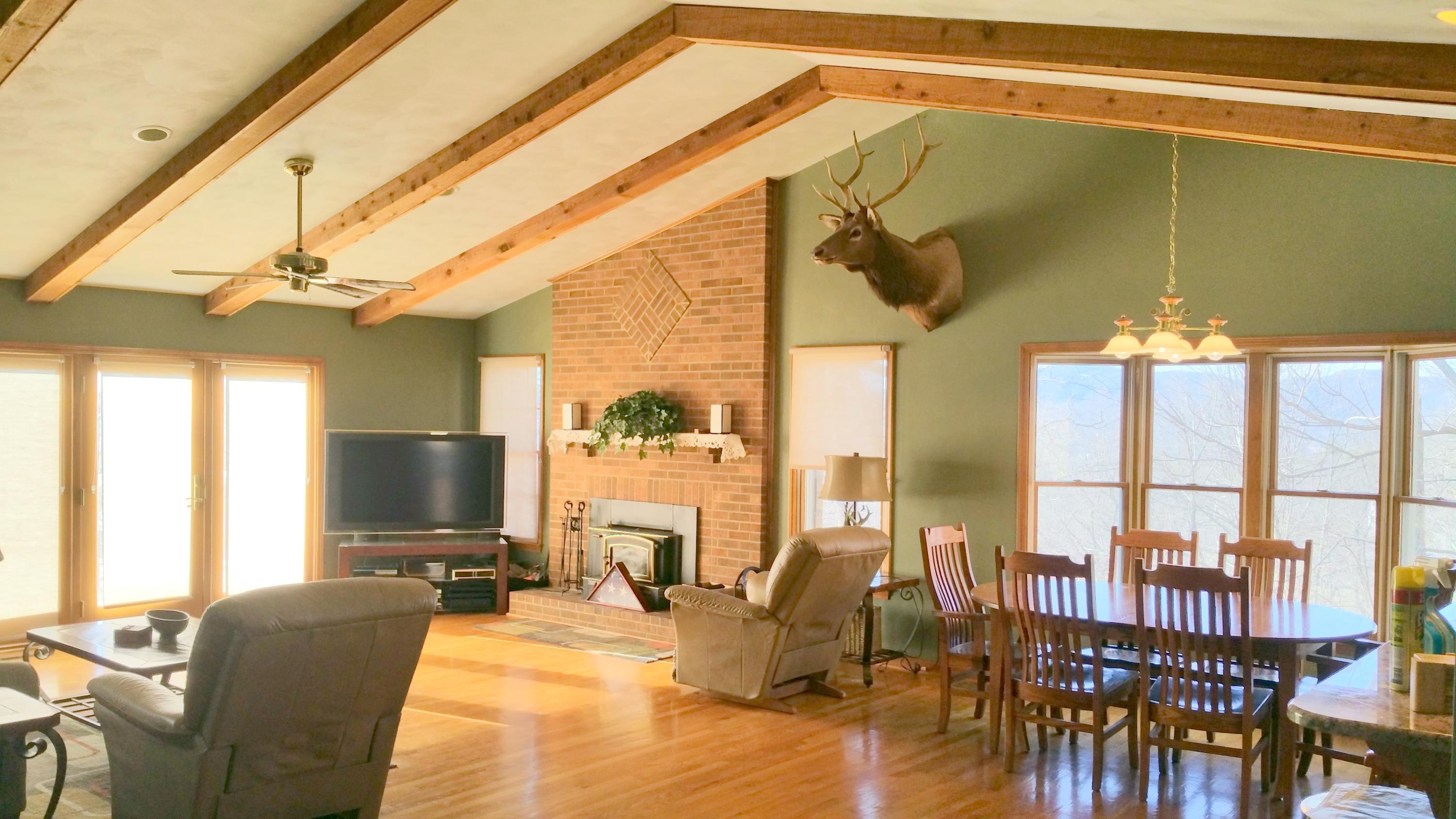1354 Archway Road Blue Ridge, VA 24064 - Photo 5 of 22 a view of a dining room with furniture window and outside view