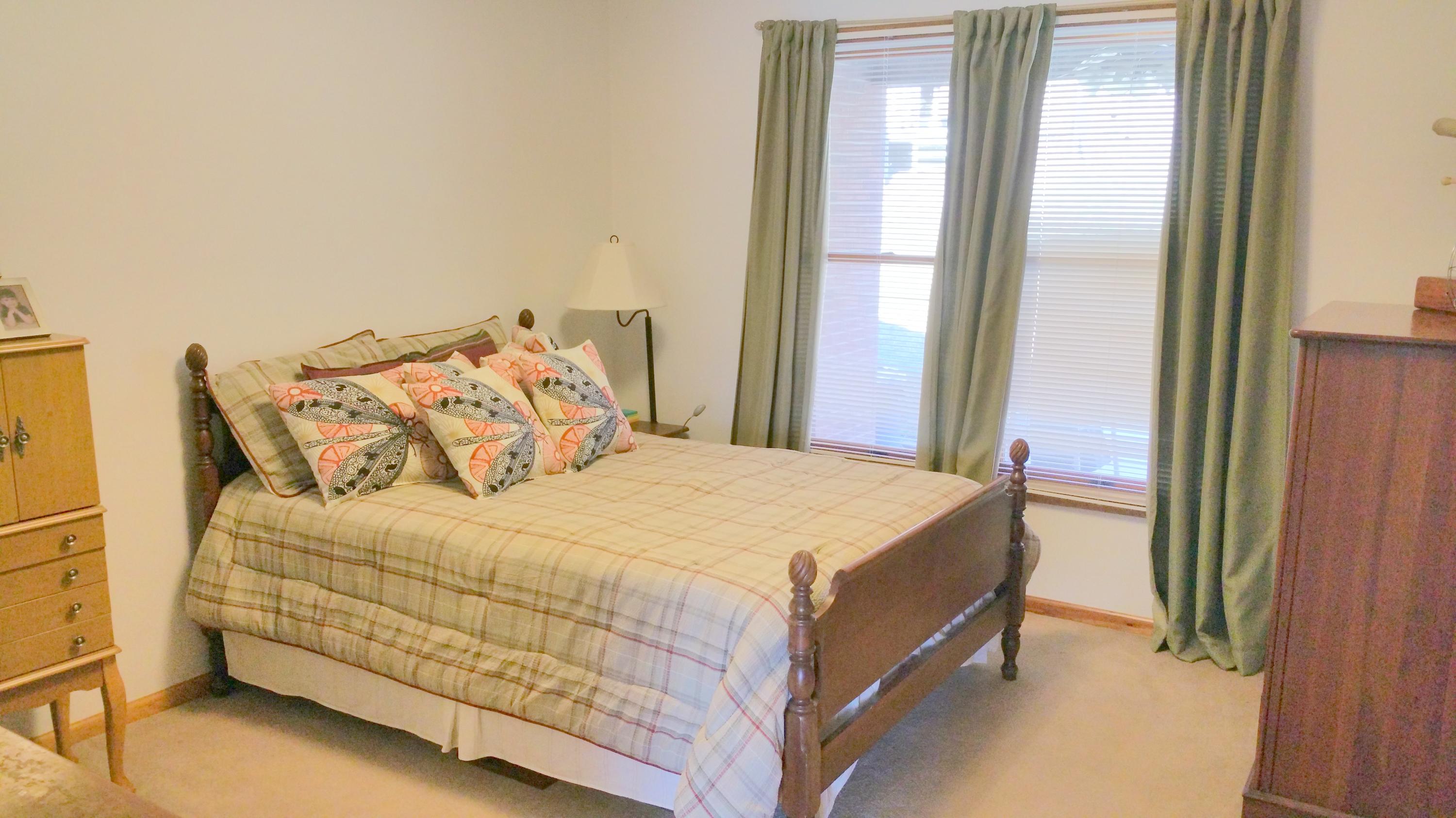 1354 Archway Road Blue Ridge, VA 24064 - Photo 9 of 22 a bedroom with a bed and a window