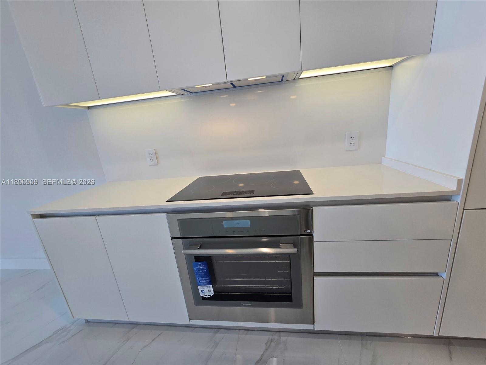 700 Northeast 24th Street, Unit 4004 Miami, FL 33137 - Photo 19 of 68 a utility room with dryer and washer