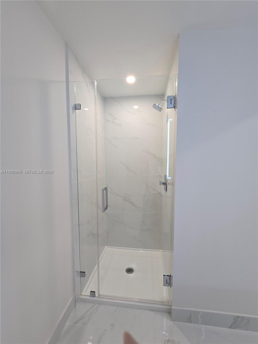700 Northeast 24th Street, Unit 4004 Miami, FL 33137 - Photo 25 of 68 a bathroom with a shower