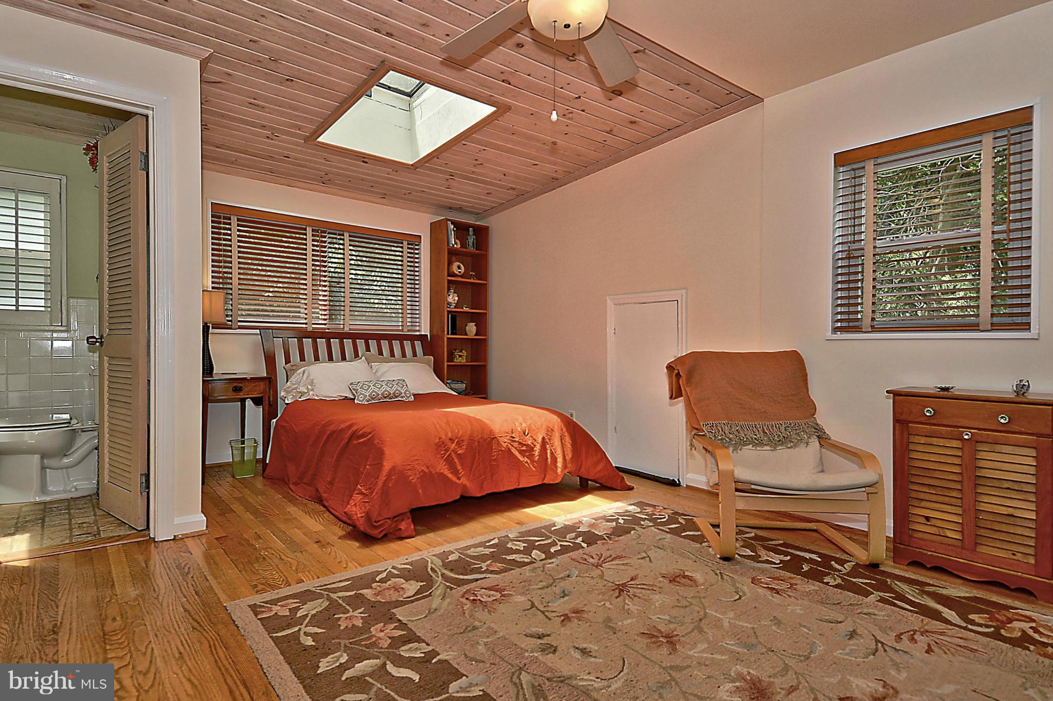 15 Park Valley Road Silver Spring, MD 20910 - Photo 15 of 30 a bedroom with a bed and wooden floor