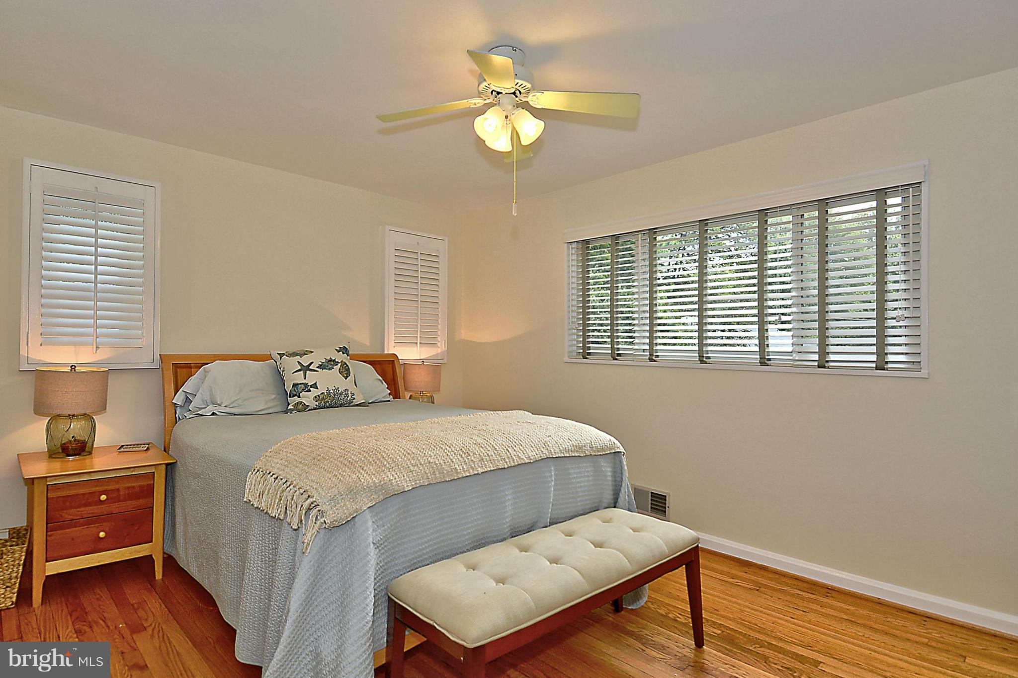 15 Park Valley Road Silver Spring, MD 20910 - Photo 18 of 30 a bedroom with a bed and wooden floor