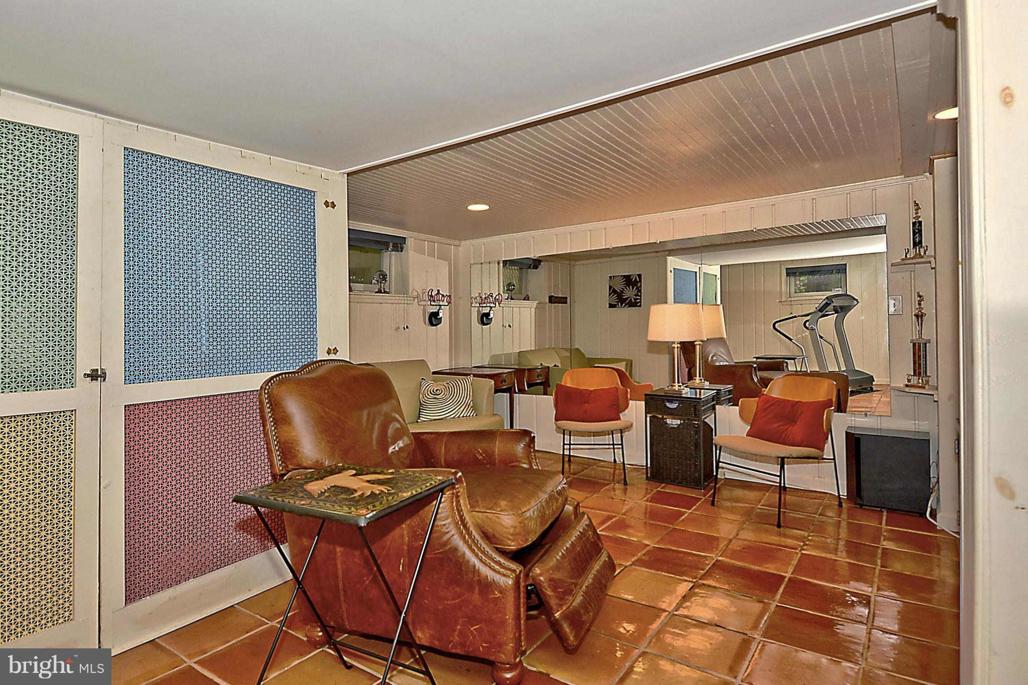 15 Park Valley Road Silver Spring, MD 20910 - Photo 21 of 30 a living room with furniture a rug and a window