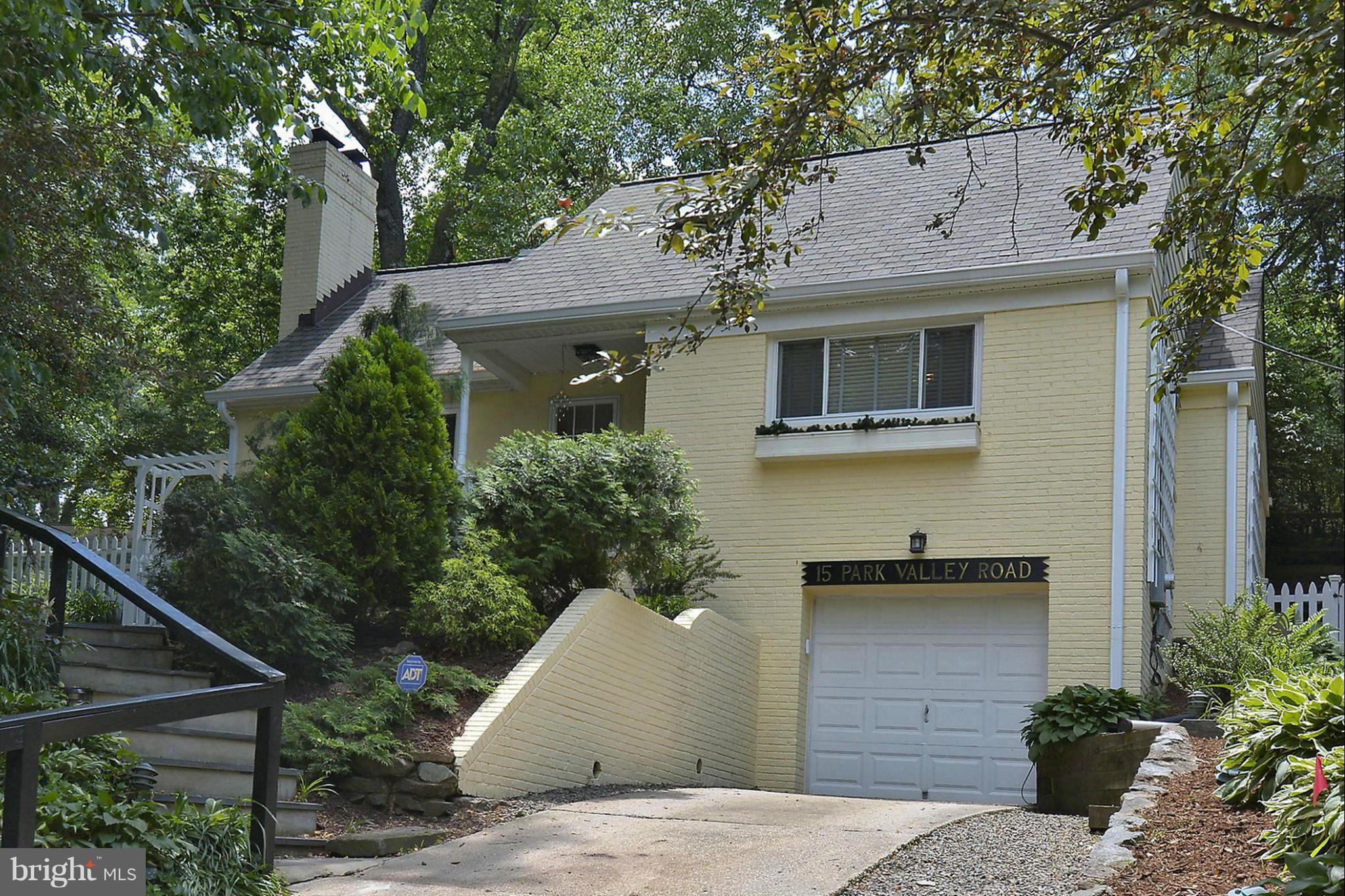 15 Park Valley Road Silver Spring, MD 20910 - Photo 4 of 30 a view of a white house with a potted plant and a large tree