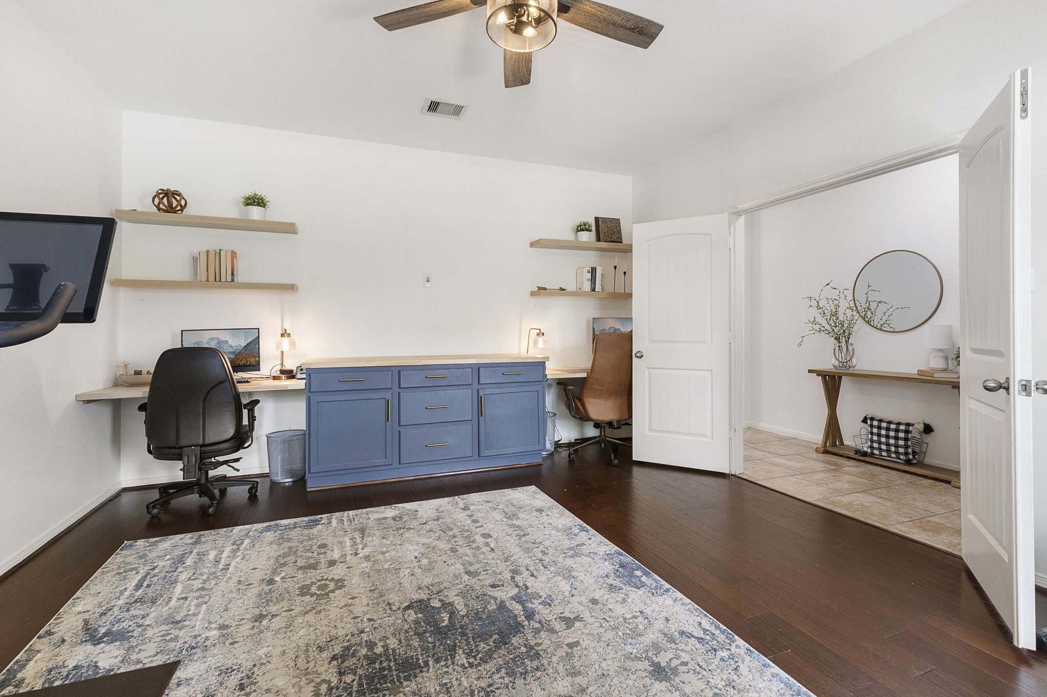 22810 Dale River Road Tomball, TX 77375 - Photo 6 of 44 Seller has upgraded the study to feature this dual desk built-in with center worktop and enclosed storage.