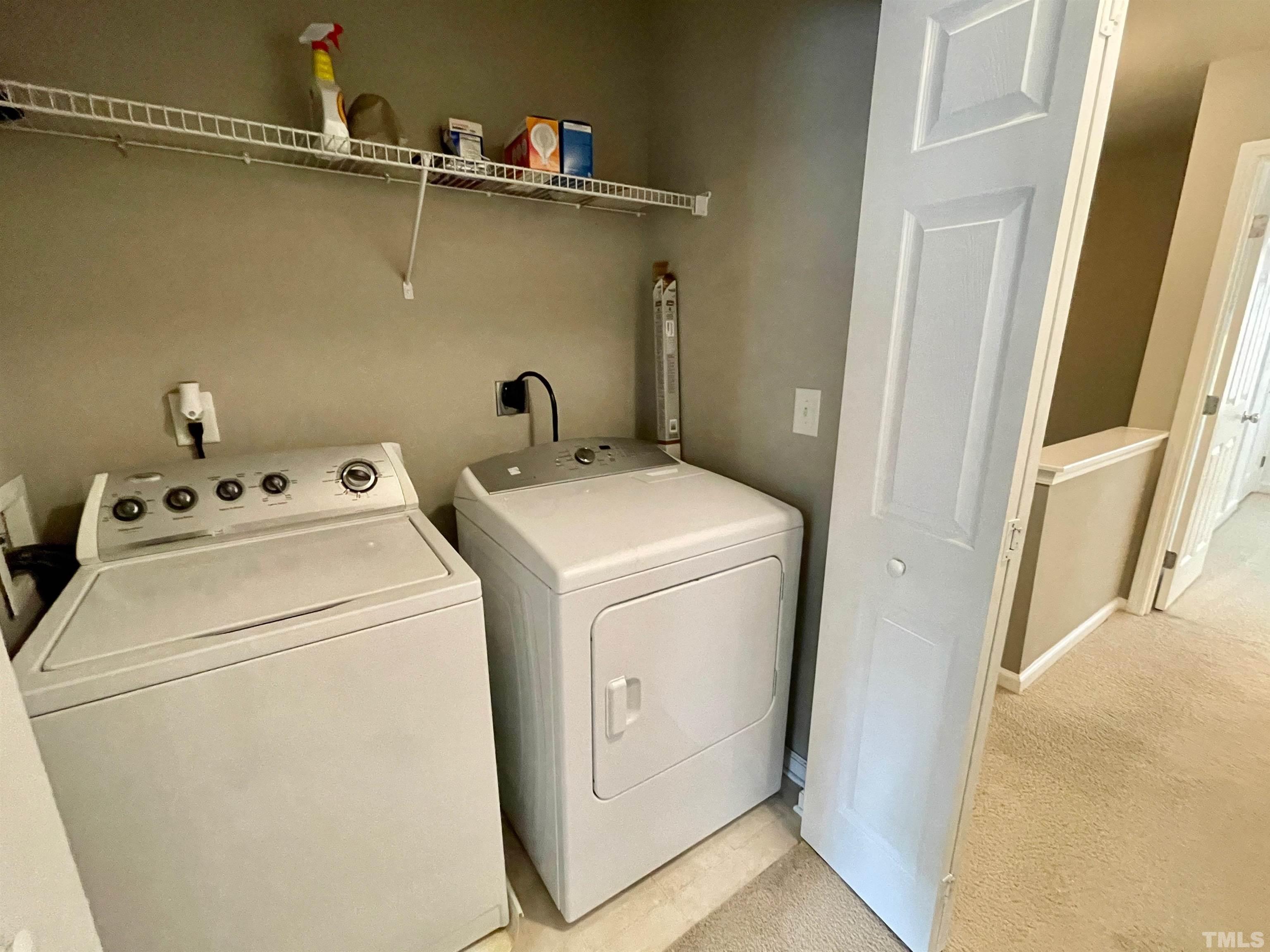 8467 Reedy Ridge Lane Raleigh, NC 27613 - Photo 37 of 46 a utility room with dryer and washer