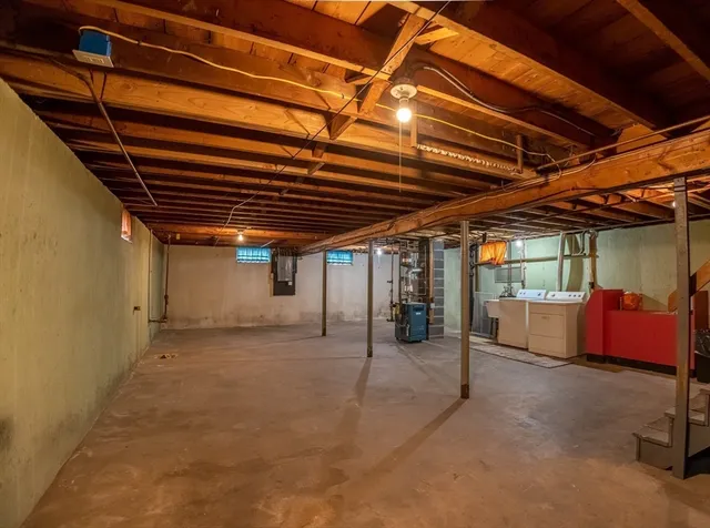 a view of empty room with wooden ceiling