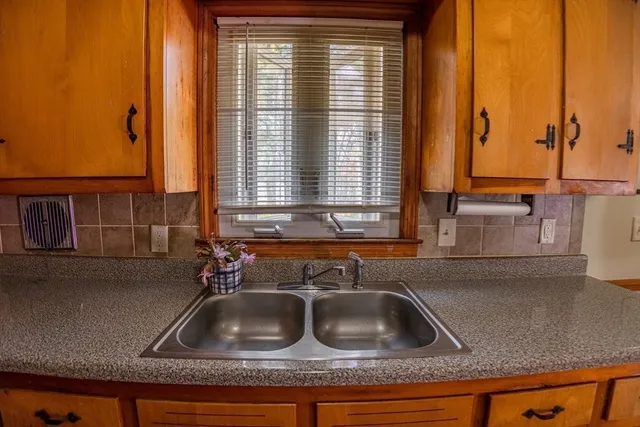 a kitchen sink with a window
