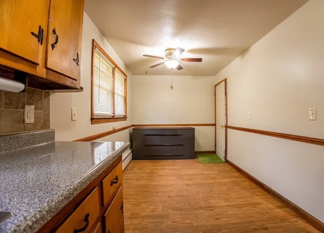 a kitchen with granite countertop a stove and a sink