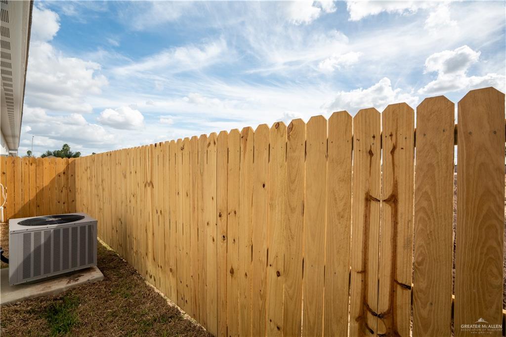 1408 South Xanthia Street, Unit 1 Alton, TX 78573 - Photo 11 of 19 a view of a room with wooden fence