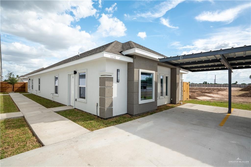 1408 South Xanthia Street, Unit 1 Alton, TX 78573 - Photo 12 of 19 a view of a house with a backyard
