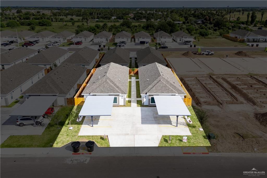 1408 South Xanthia Street, Unit 1 Alton, TX 78573 - Photo 18 of 19 an aerial view of residential houses with outdoor space